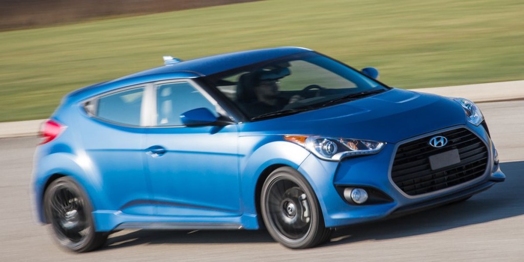 A blue, turbocharged 2016 Veloster on the track.