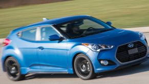 A blue, turbocharged 2016 Veloster on the track.
