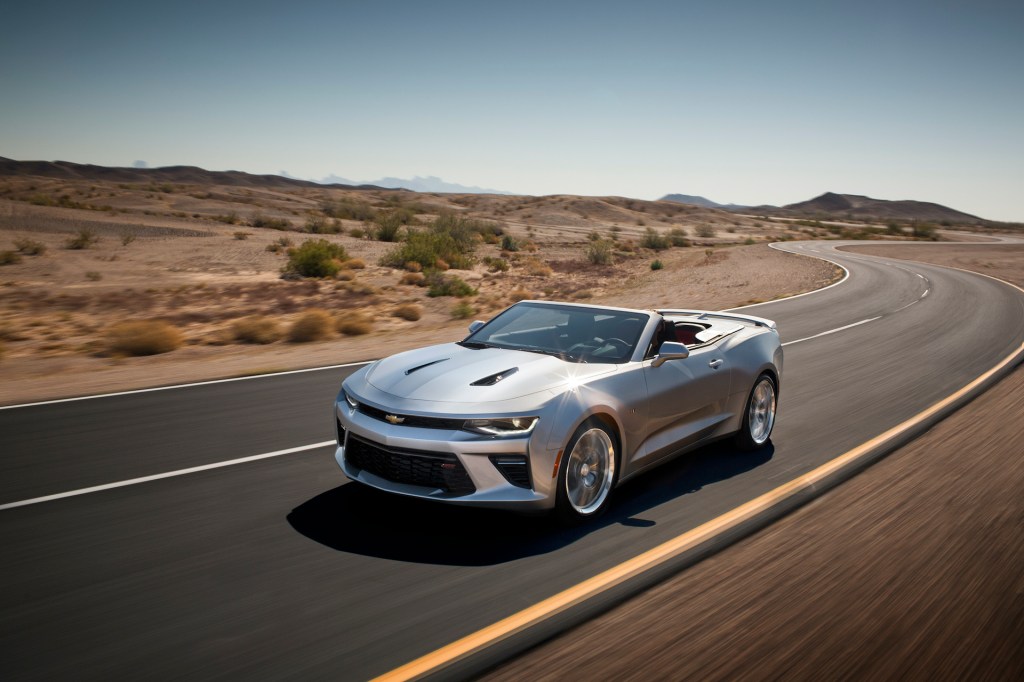 An image of a Chevy Camaro Convertible rolling down the road.