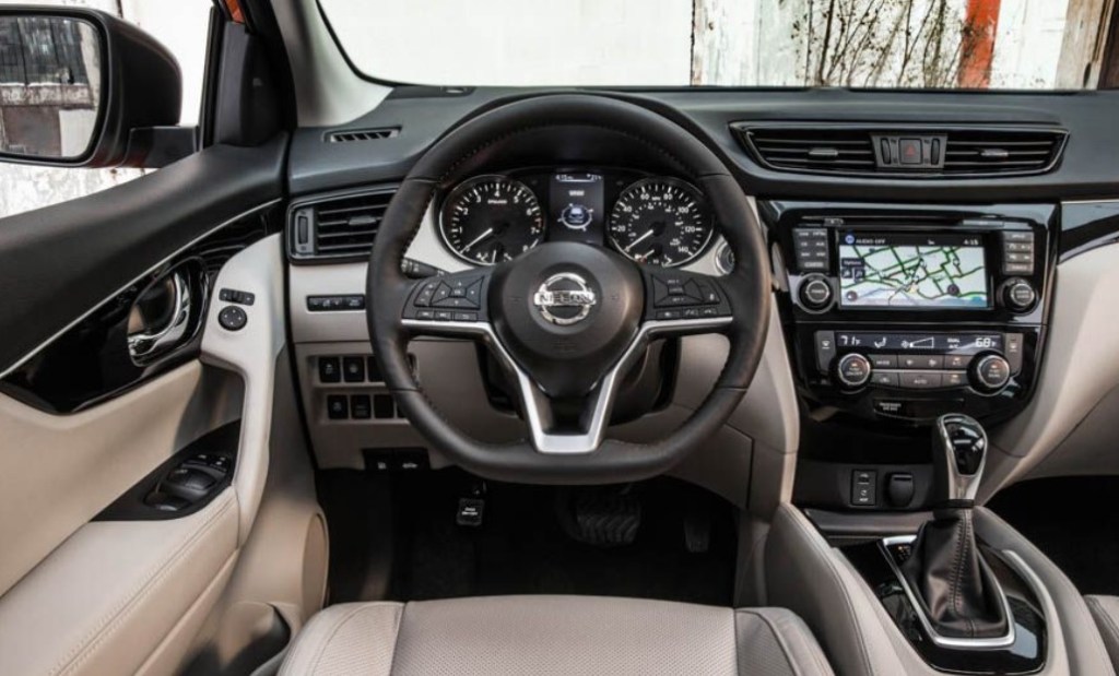 Driver's seat of a 2019 Nissan Rouge with a beige interior .