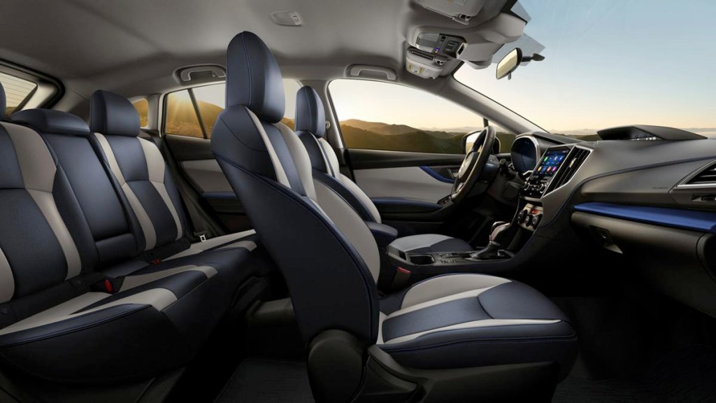 A sideview of a 2019 Crosstrek with black leather seats.