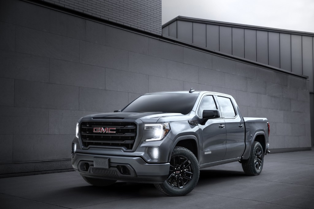A gray 2020 GMC Sierra 1500 parked in front of a gray wall