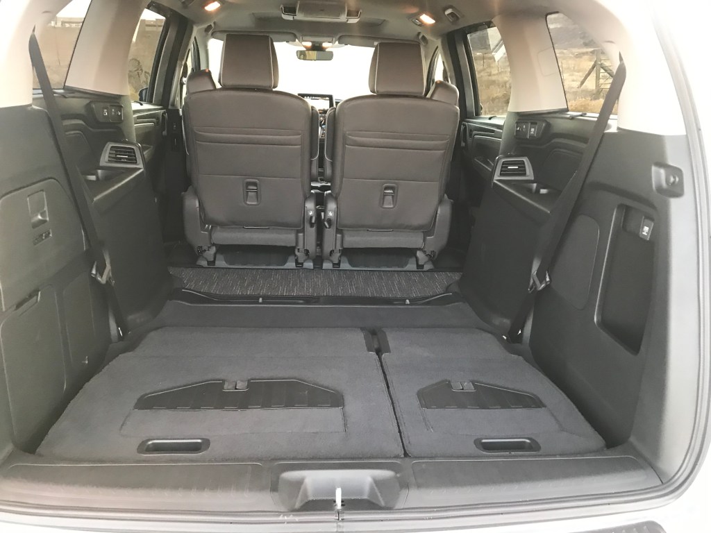 A 2021 Honda Odyssey with all the rear seats folded doen.