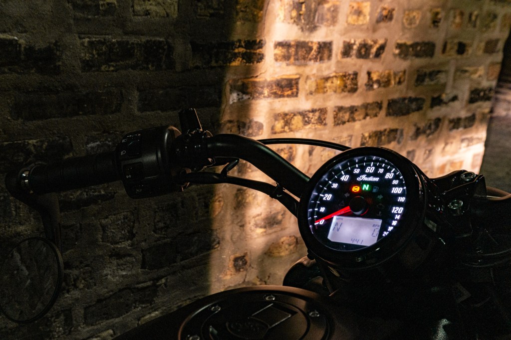 A close-up of the 2021 Indian Scout Bobber's gauge at night