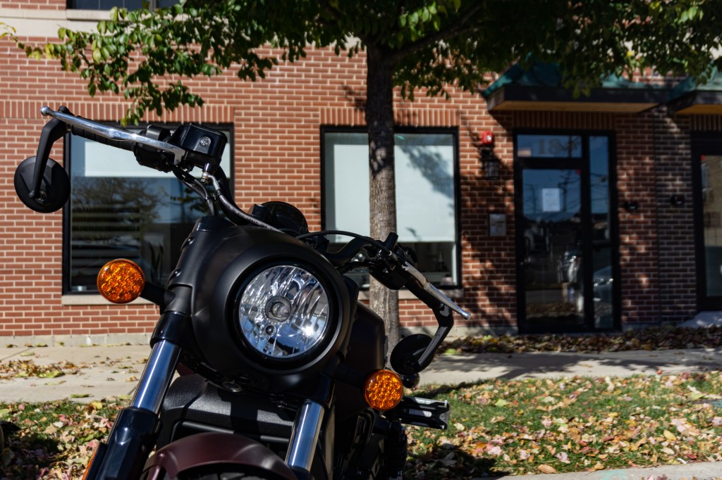 A close-up of the 2021 Indian Scout Bobber's headlight and handlebars