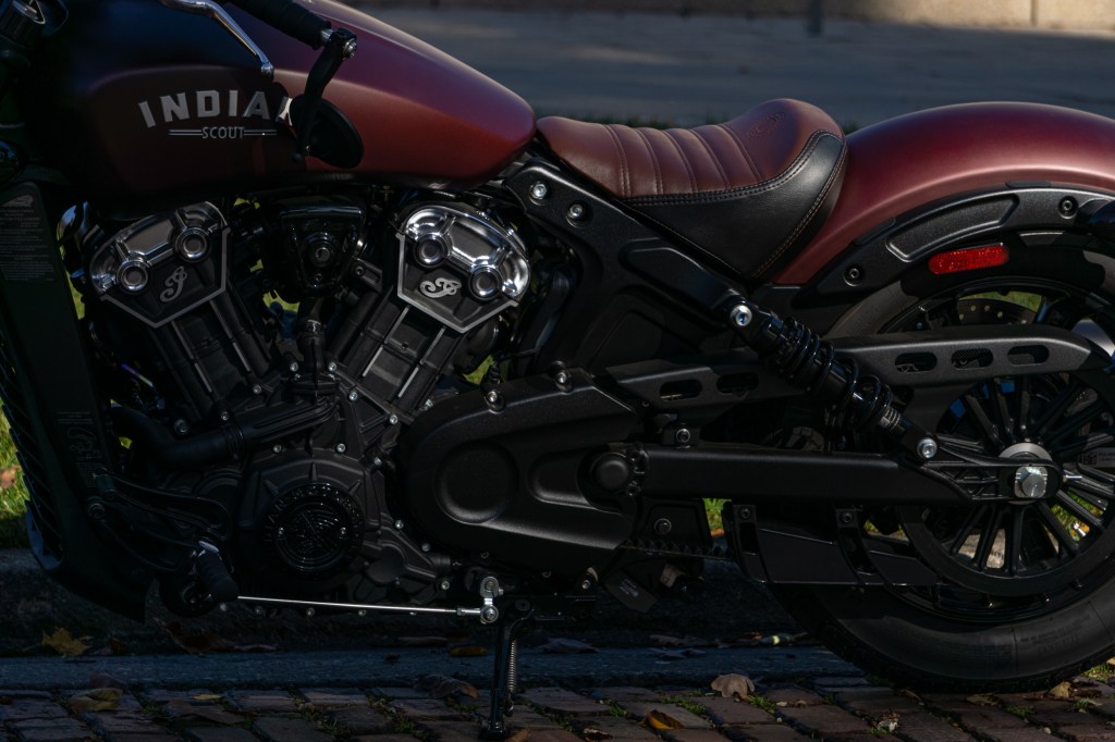 The rear-half of a maroon 2021 Indian Scout Bobber