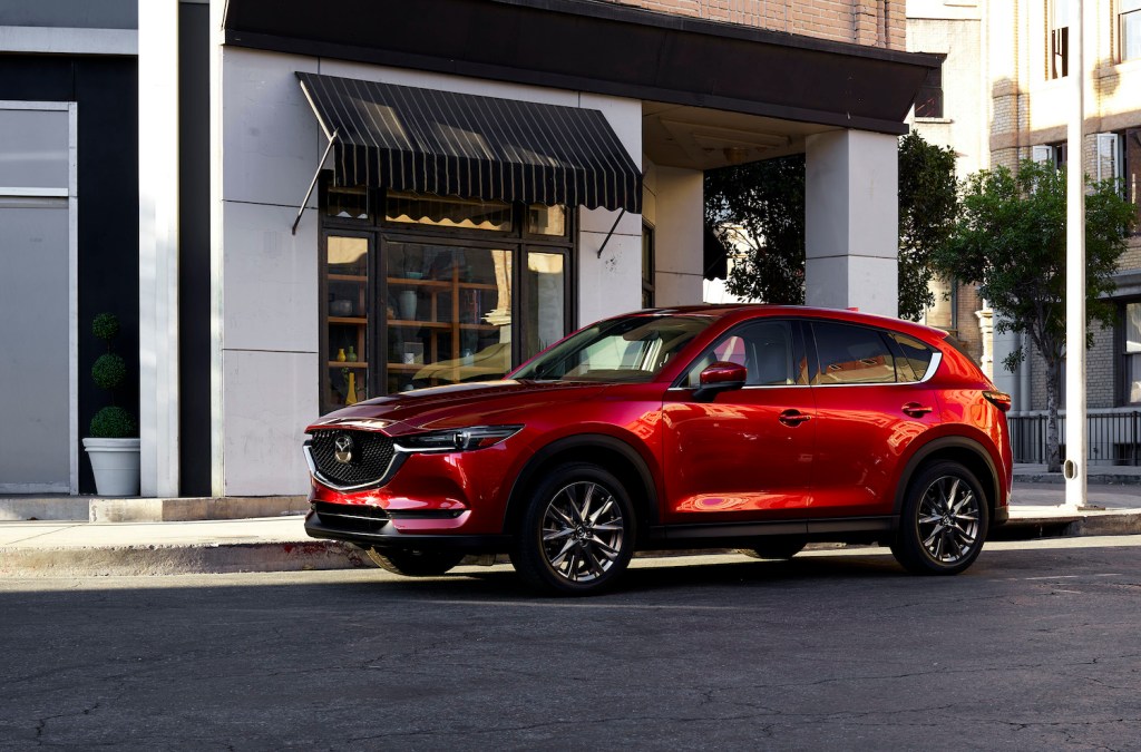 An image of a red Mazda CX-5 parked outside.