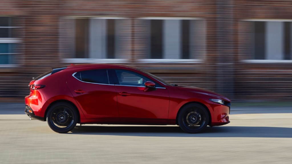 The side view of a red 2021 Mazda3 Turbo Premium Plus
