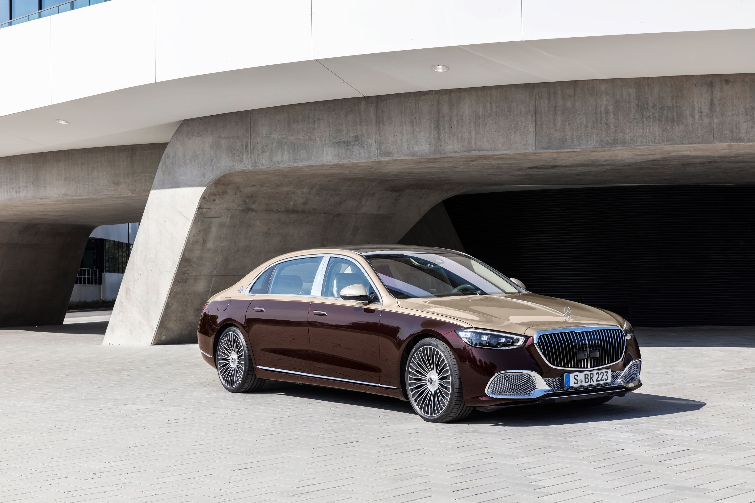 A gold-and-maroon 2021 Mercedes-Maybach S-Class