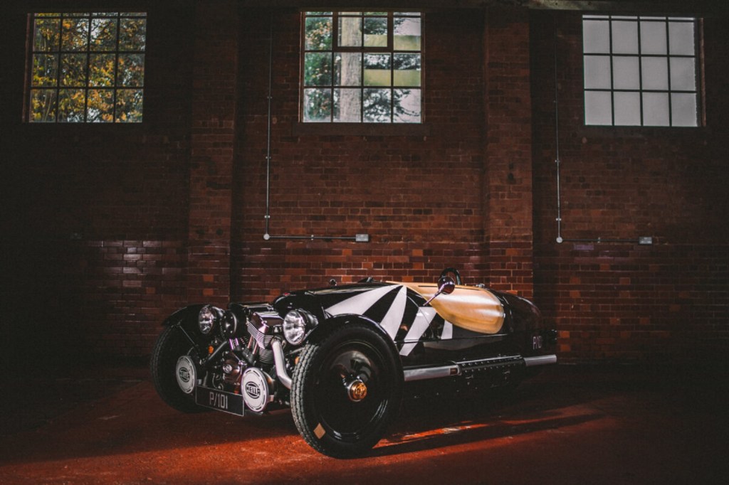 A black-and-white 2021 Morgan 3-Wheeler Dazzleship with its tonneau cover