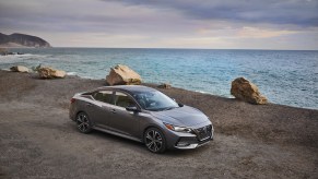 A silver 2021 Nissan Sentra parked by the water