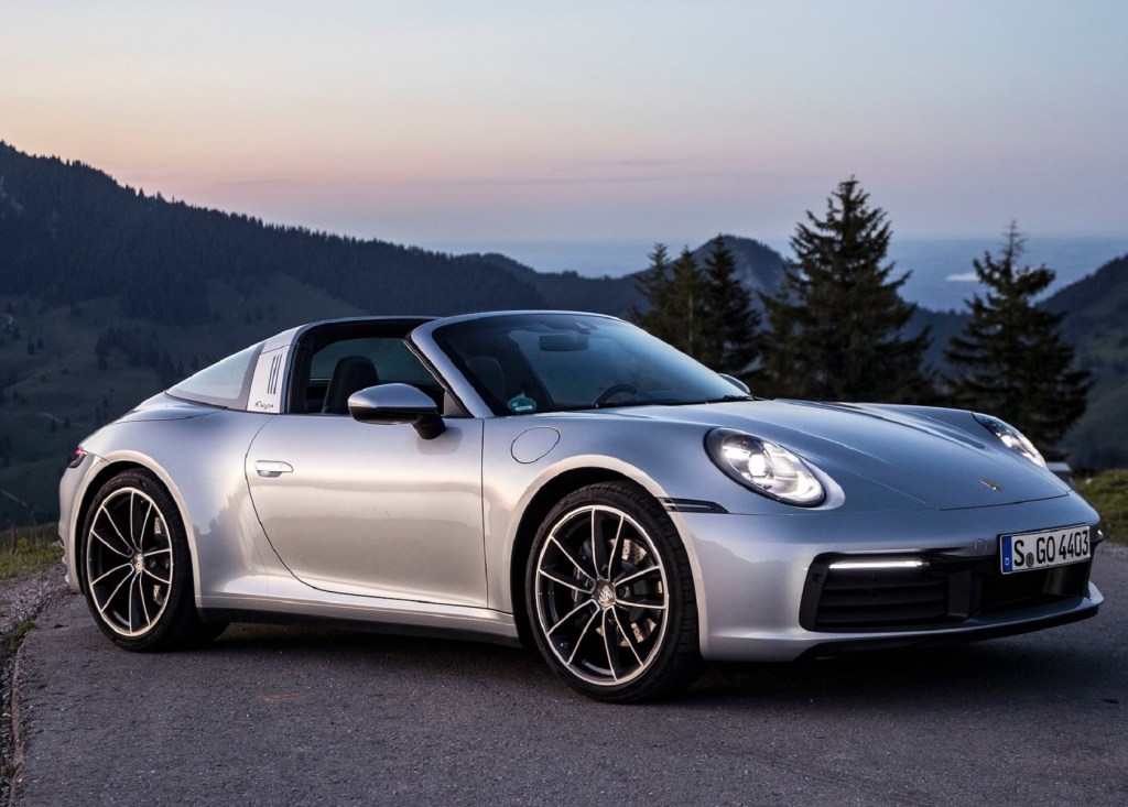 A silver 2021 Porsche 911 Targa 4 on a sunset mountaintop