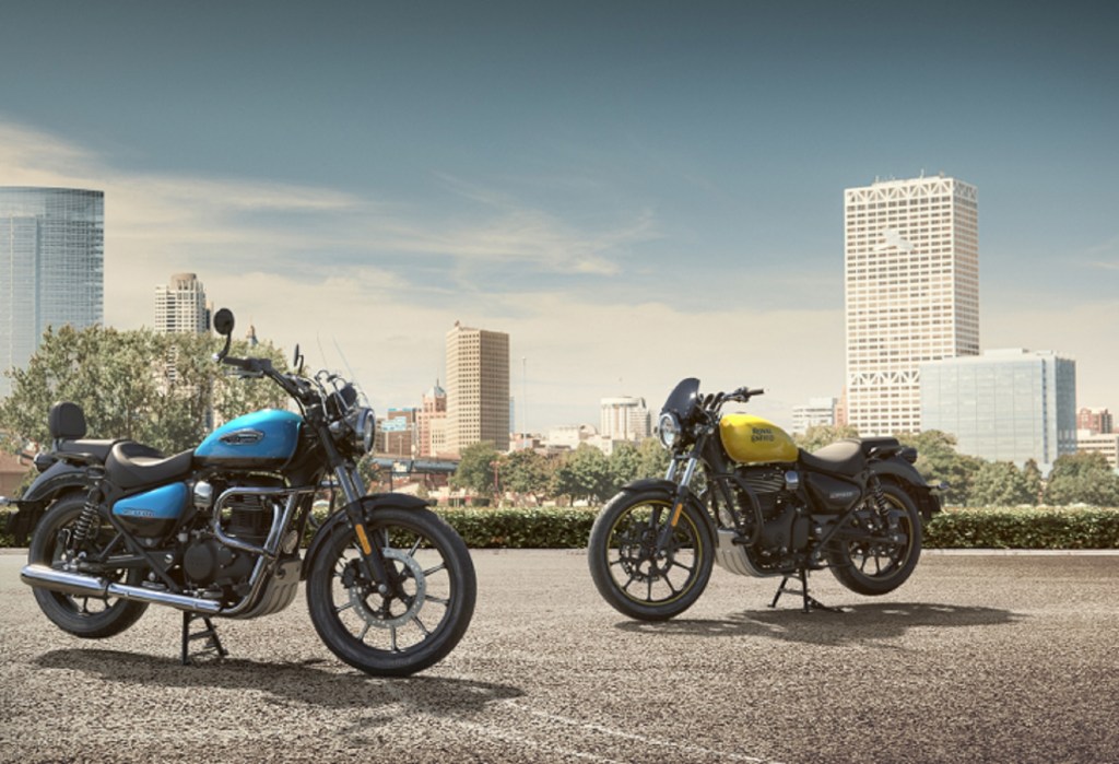 A blue and a yellow 2021 Royal Enfield Meteor 350 on center stands