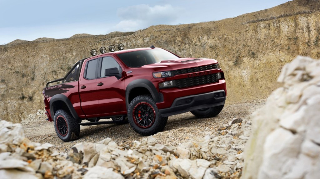 A red 2021 SVE Yenko Chevrolet Silverado Off-Road climbs a rocky desert mountainside