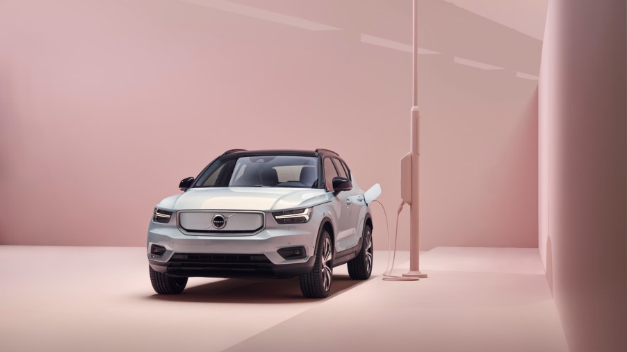 A silver 2021 Volvo XC40 Recharge connected to a charging port