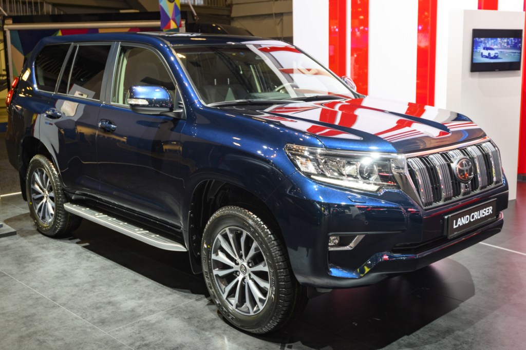 A Toyota Land Cruiser on display at an auto show