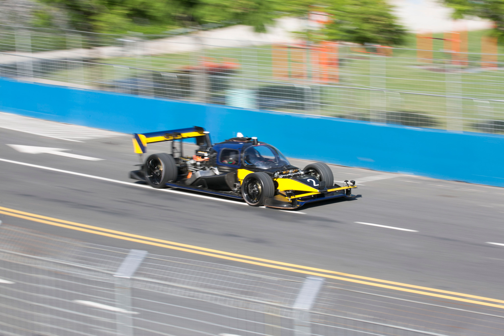 A photo of the Roborace DevBot at a race track.