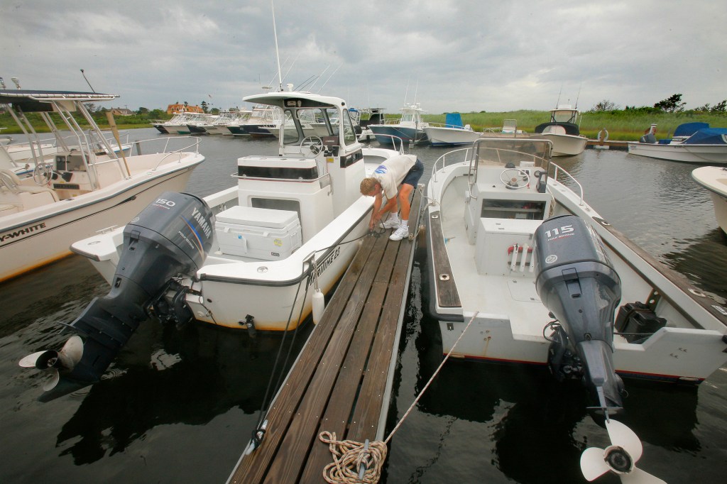 Two boats tied up a dock