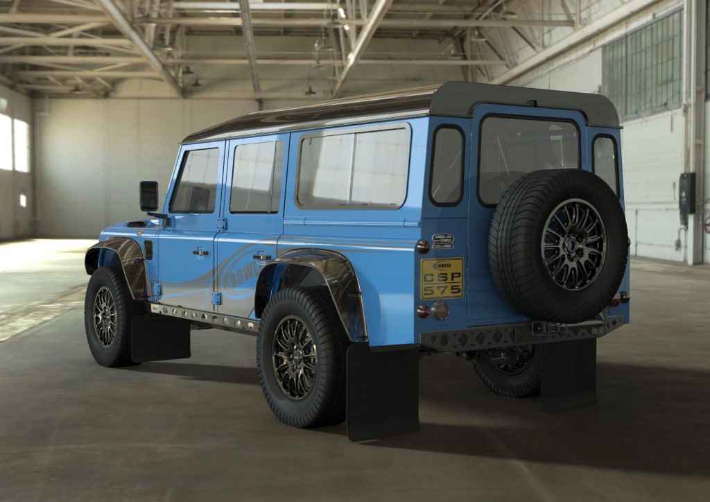 The rear 3/4 view of a blue Bowler CSP 575 Land Rover Defender