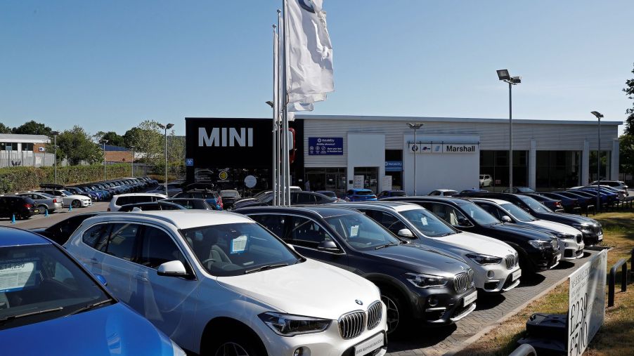 New and used cars are pictured on the forecourt at a re-opened BMW car dealership, in Hook, southwest of London, following the easing of the lockdown restrictions during the novel coronavirus COVID-19 pandemic