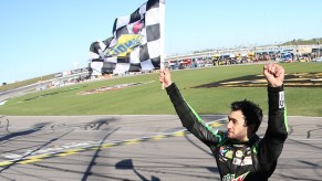 Chase Elliott celebrates a NASCAR race win.