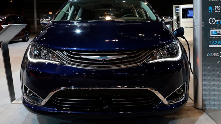 A Chrysler Pacifica Hybrid on display at an auto show