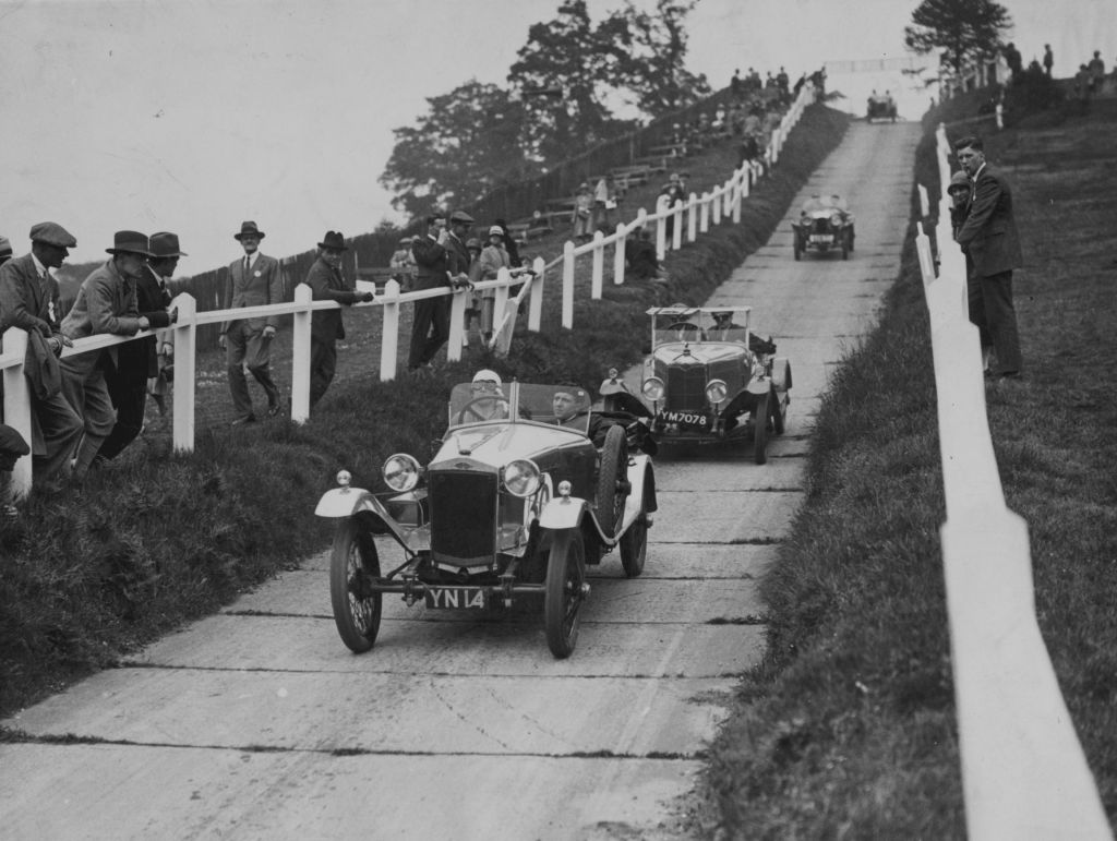 Frazer-Nash cars undergoing reliability testing on a paved hill