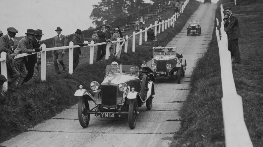 Frazer-Nash cars undergoing reliability testing on a paved hill