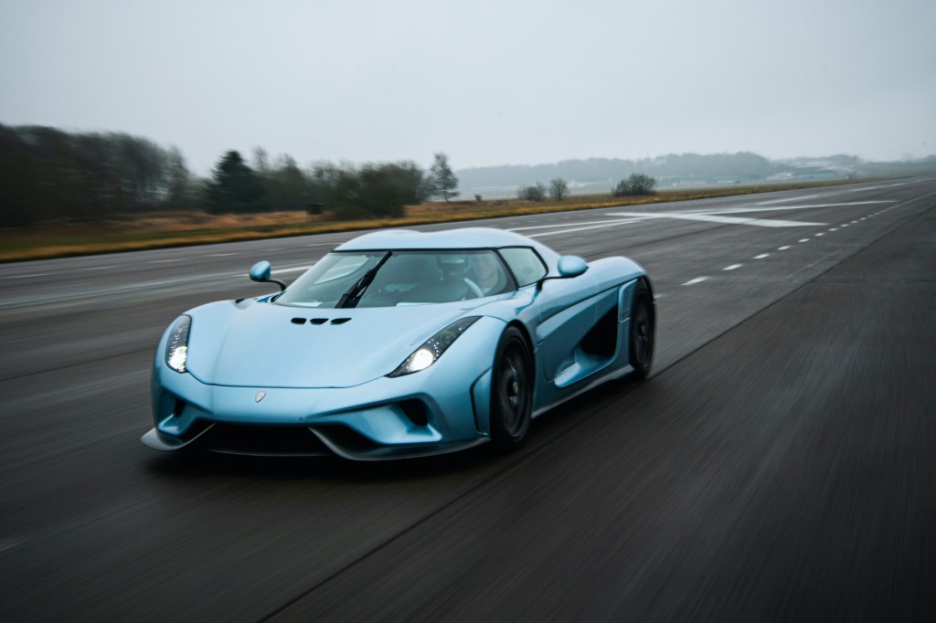 An image of a Koenigsegg Regera speeding down a runway.