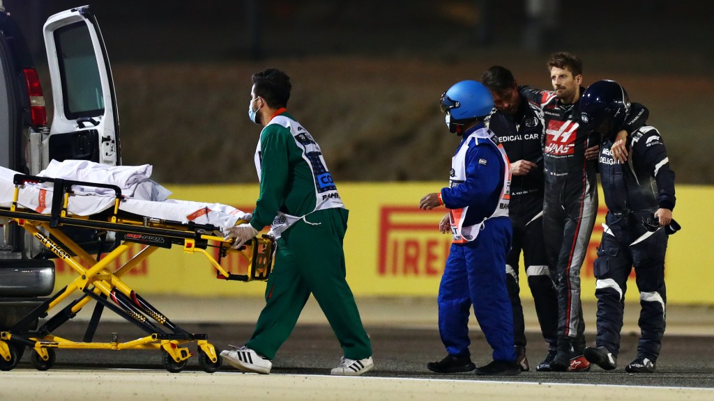 An image of Romaine Grosjean walking away from a major accident during the Bahrain Grand Prix.