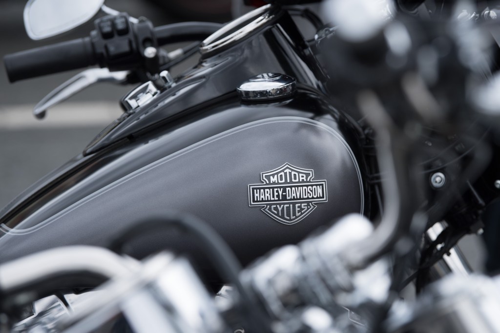 Harley Davidson motorcycles stand side by side before the start of a biker parade on the occasion of the Harley Days Dresden 2019