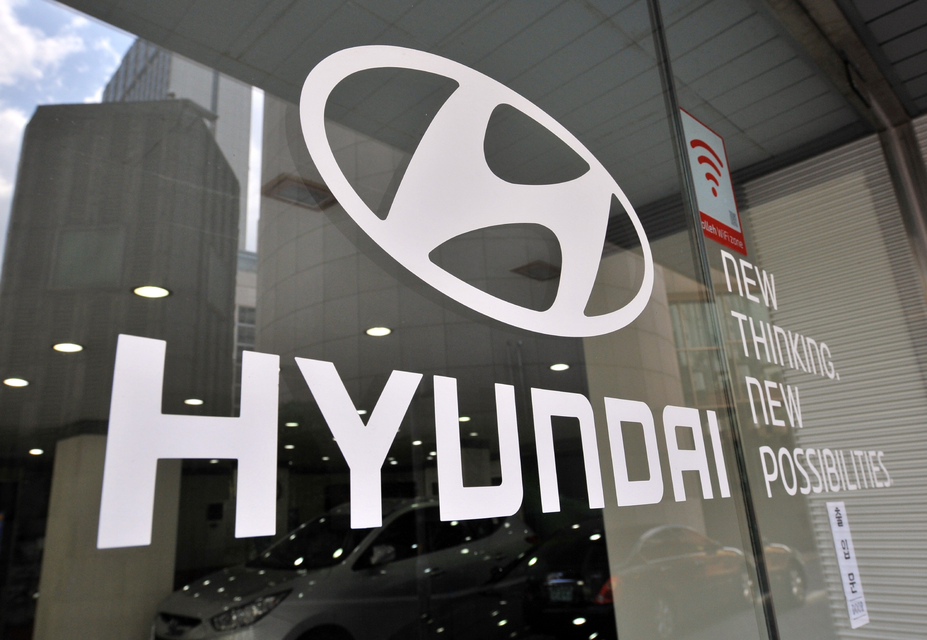 The Hyundai logo printed on a window
