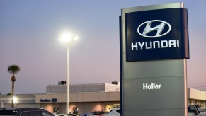 Cars are seen at a Hyundai car dealership. Hyundai and Kia announced on October 11, 2019 that they have agreed to settle a class action lawsuit over engine fireshttps://www.motorbiscuit.com/the-hyundai-veracruz-walked-so-the-hyundai-santa-fe-could-run/