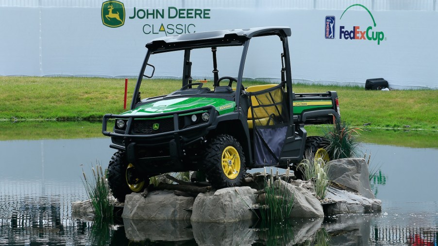 A John Deere Gator vehicle is seen adjacent to the 18th green during the fourth and final round of the John Deere Classic