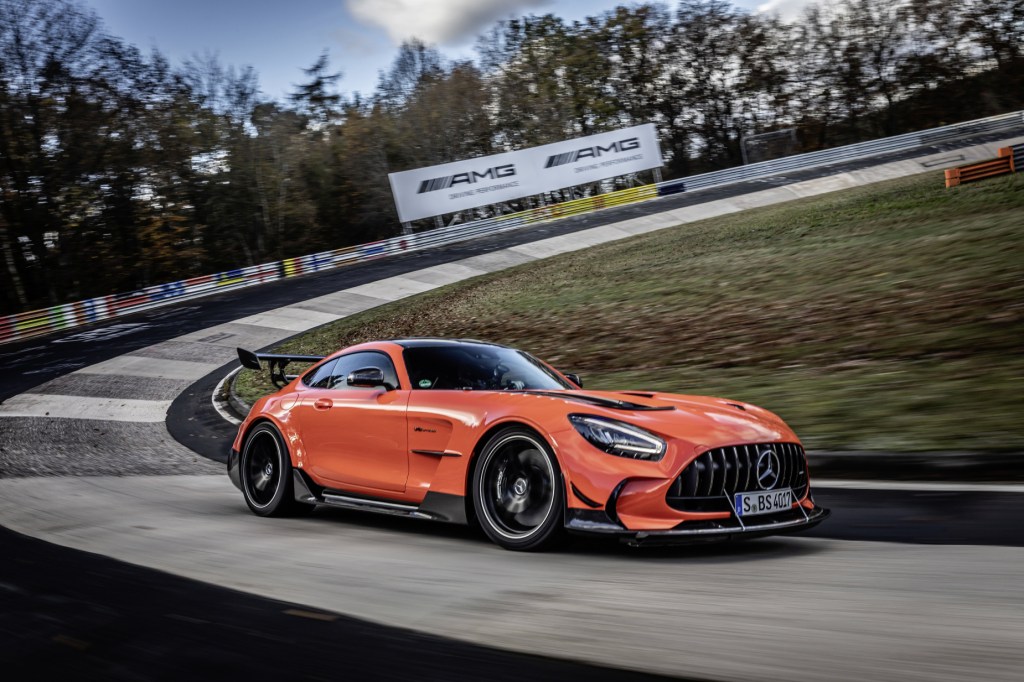 The record-breaking orange Mercedes-AMG GT Black Series driving on the Nürburgring course