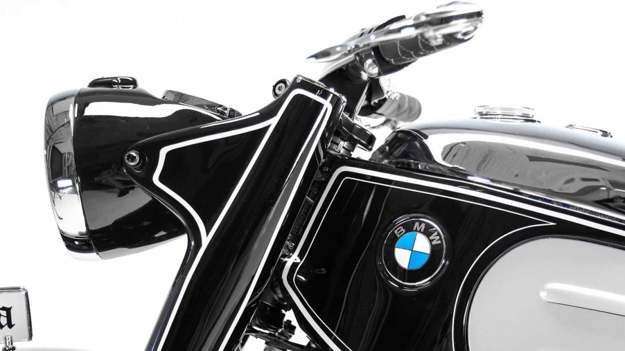 The forks, headlight, and handlebars of a custom BMW motorcycle