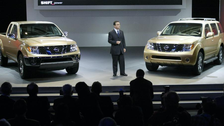 Carlos Ghosn, President and CEO of Nissan Motor Company introduces the new 2005 Frontier (L) and Pathfinder (R) during the press days 05 January 04 at the North American International Auto Show