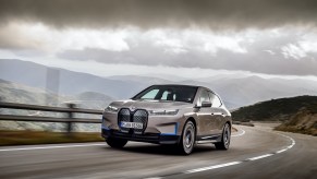 A photo of the BMW iX out on the road.