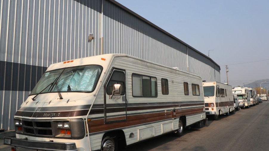 RVs parked along the side of a building