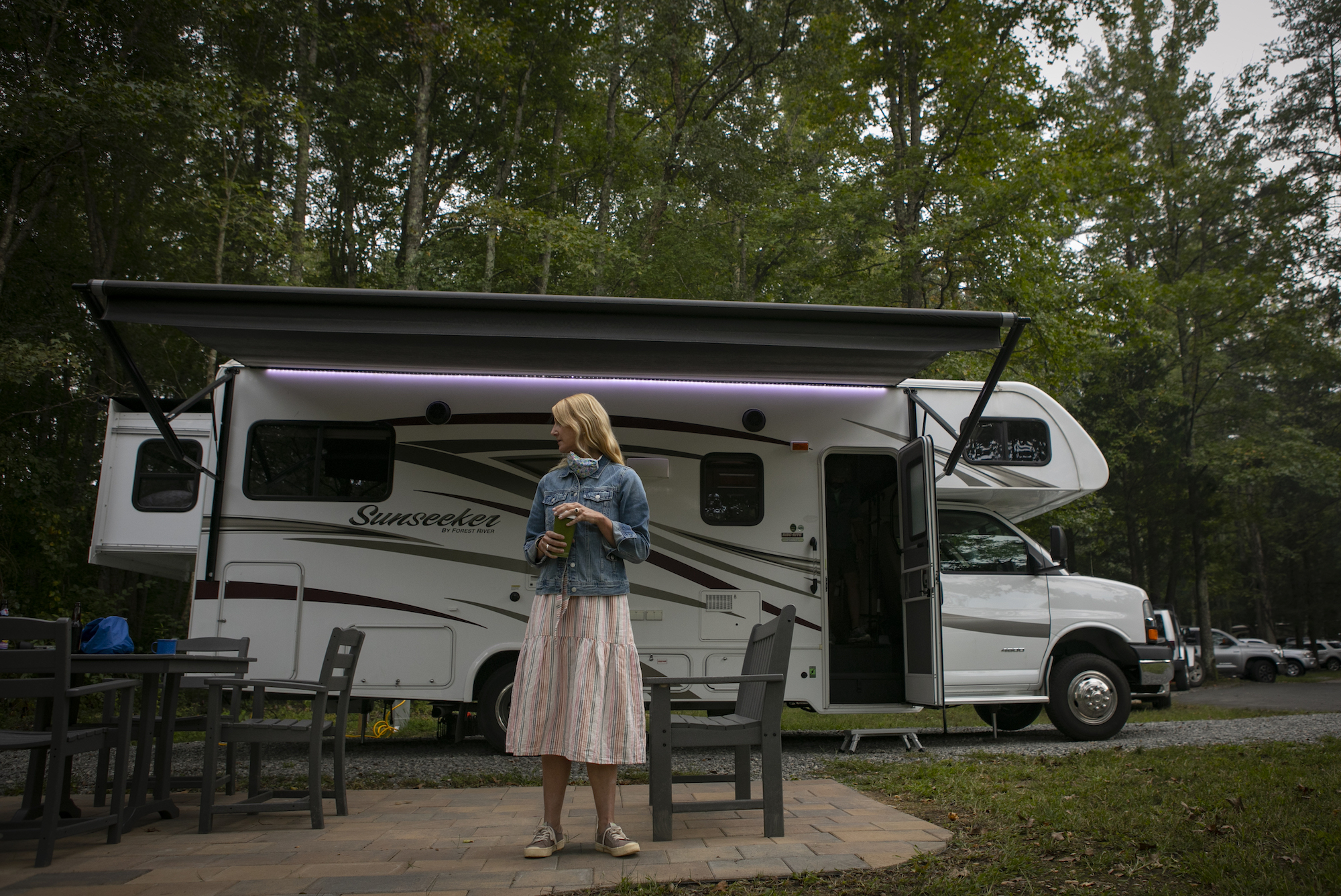 Washington Post travel writer Andrea Sachs stands outside of her rented RV Saturday, September 19, 2020 at a KOA campground in Fredericksburg, Virginia.