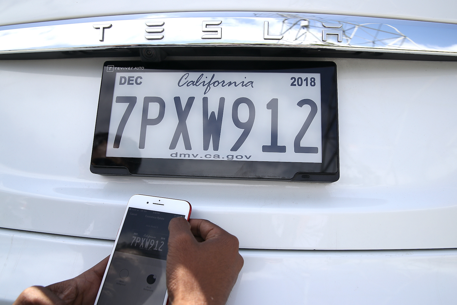 Reviver's digital license plate on a Tesla