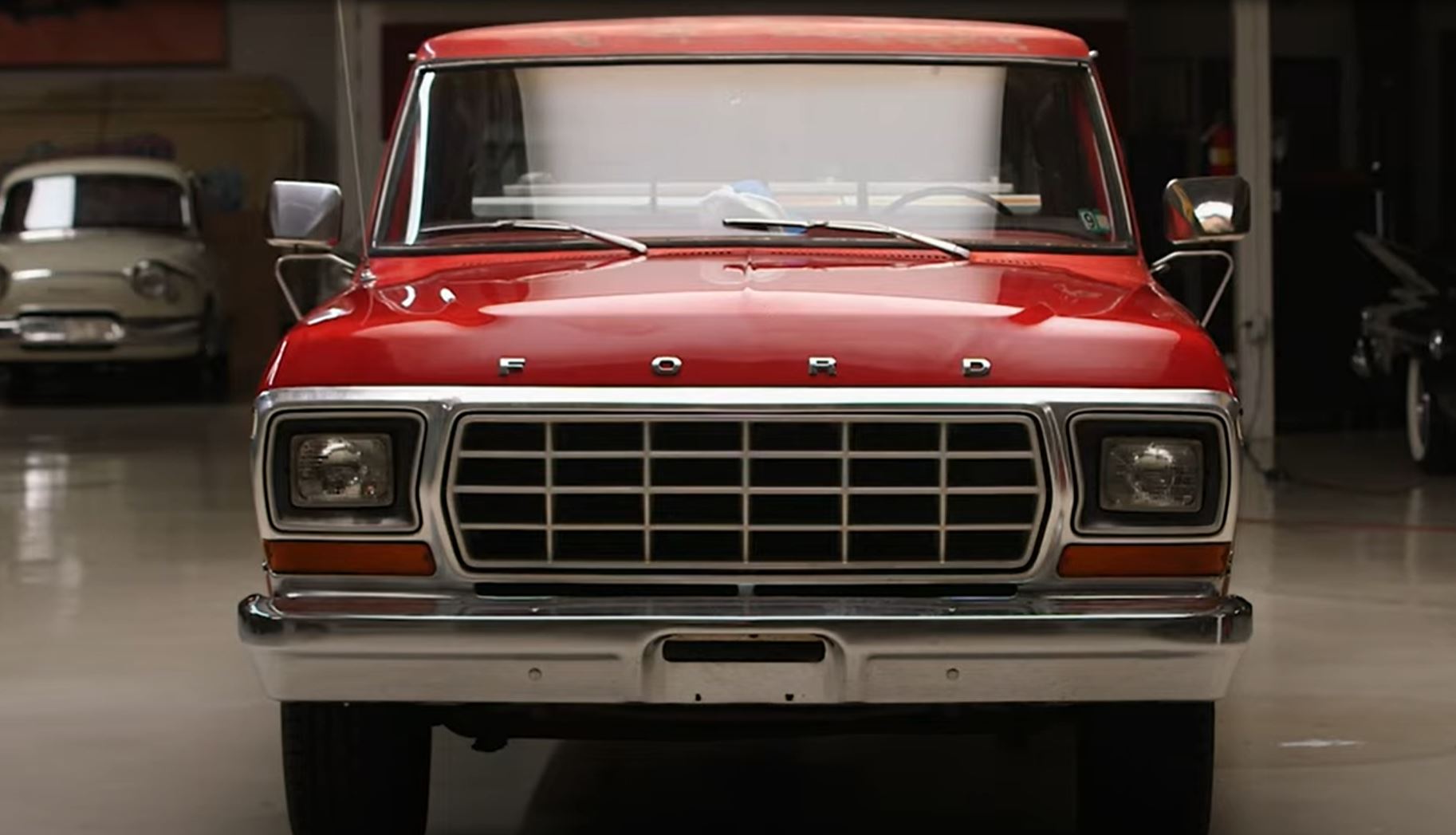 The front of a red 1979 Ford F-150 Custom pickup truck