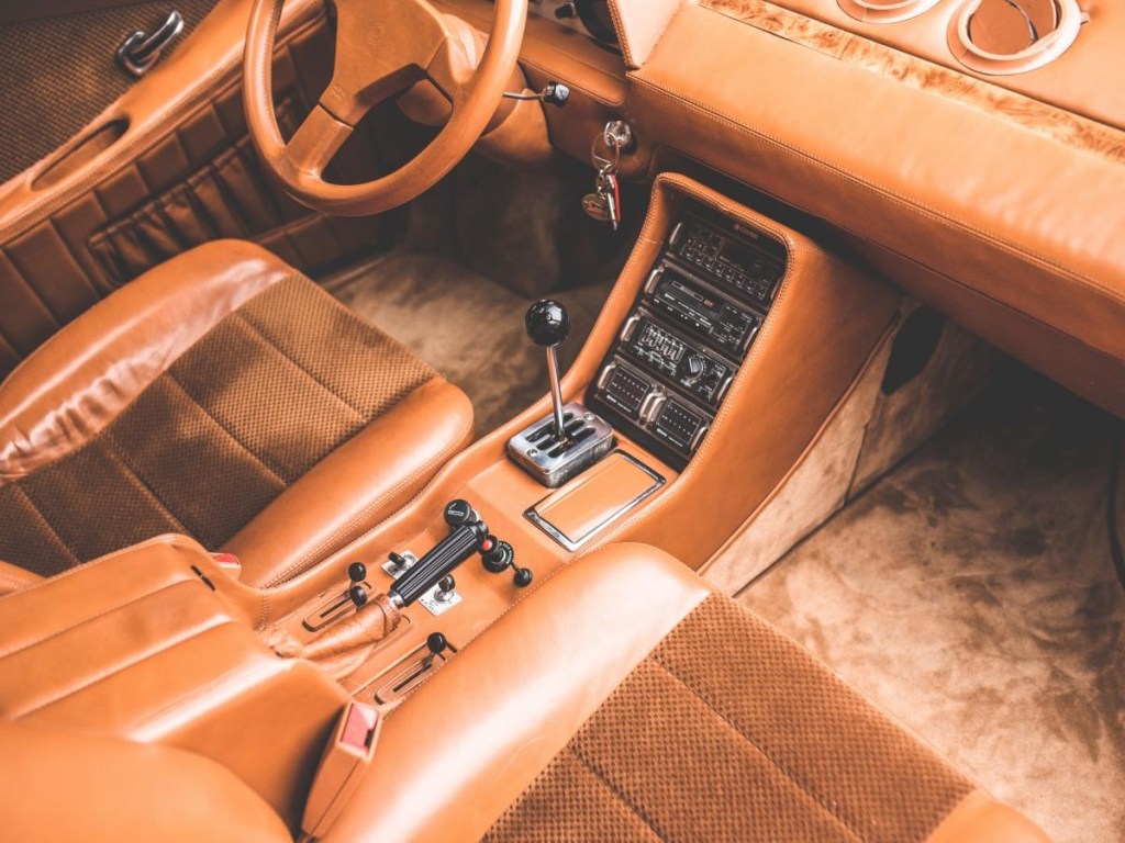 The tan leather front seats and dashboard of the Sbarro Super Eight