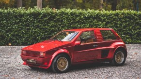 The red Sbarro Super Eight by a green hedge