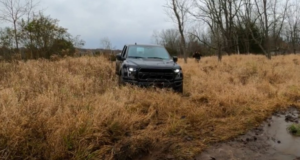 The front of a black Ford Raptor.