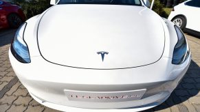 A picture taken on September 5, 2020 shows the front of a "Tesla Model Y" car, an all-electric compact SUV by US electric car giant Tesla, during its presentation at the Automobile Club