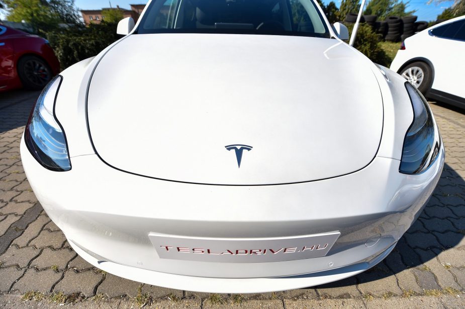 A picture taken on September 5, 2020 shows the front of a "Tesla Model Y" car, an all-electric compact SUV by US electric car giant Tesla, during its presentation at the Automobile Club