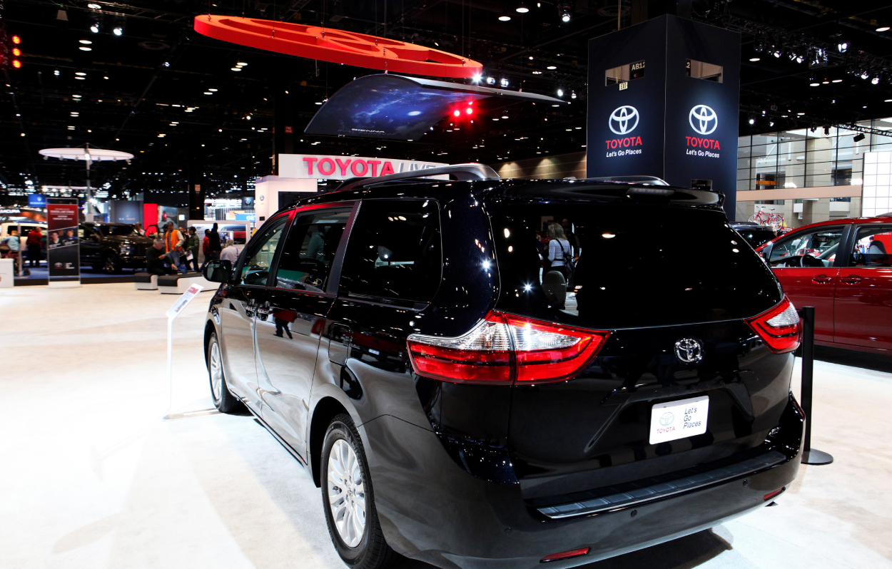 A black Toyota Sienna on display at an auto show