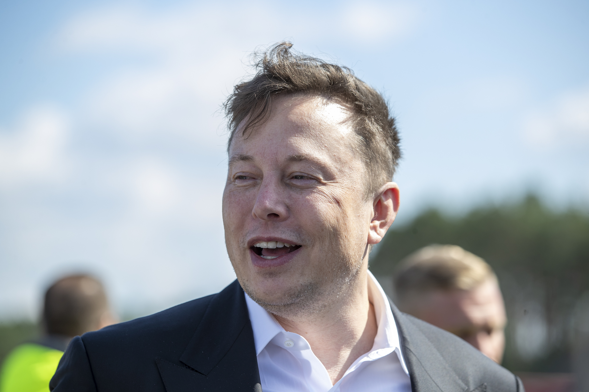 Tesla head Elon Musk talks to the press as he arrives to to have a look at the construction site of the new Tesla Gigafactory near Berlin on September 03, 2020, near Gruenheide, Germany.