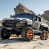 A photo of the Rezvani Hercules 6X6 in the desert.